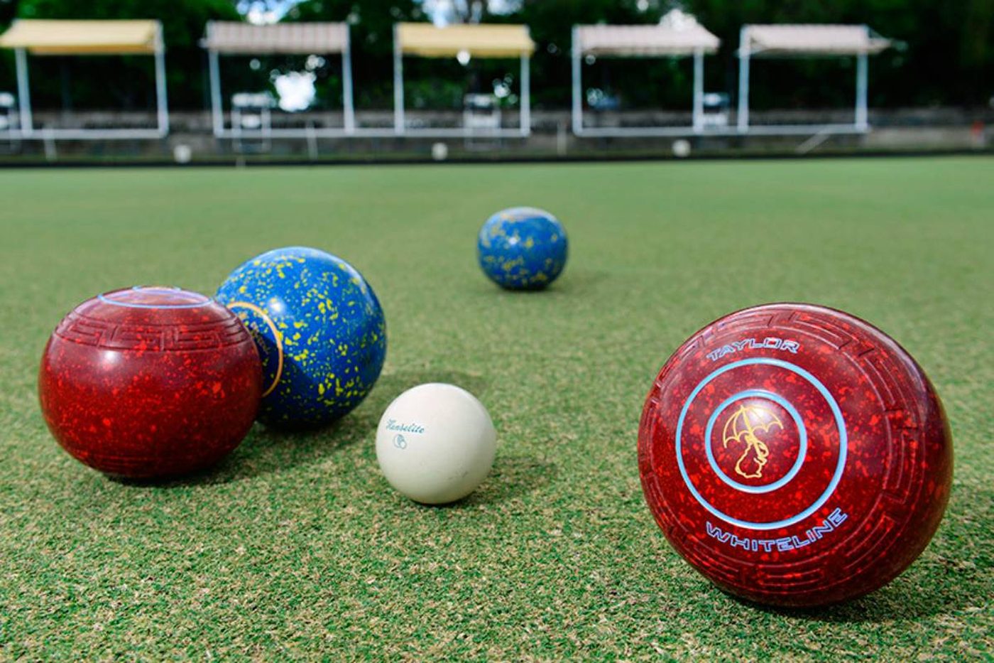 Bowlers on a well-kept green on a sunny afternoon